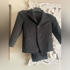 Black suit with white pen strip